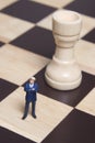Figurine and chess Royalty Free Stock Photo