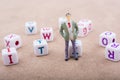 Figurine and the colorful alphabet letter cubes Royalty Free Stock Photo