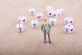 Figurine and the colorful alphabet letter cubes Royalty Free Stock Photo