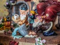 Figurine elves in Santas workshop scrubbing floor. Royalty Free Stock Photo