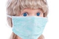 Figurine of girl in a medical mask isolated on white background. Face mask protection against pollution, virus, flu and