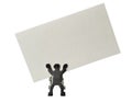 Figurine holding a piece of blank business card