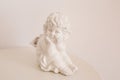 Figurine and interior concept - white ceramic angel Royalty Free Stock Photo