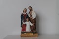 Figurine of Jesus Christ with his parents on a white background