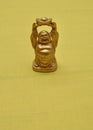 Figurine of a laughing and cheerful golden Buddha Royalty Free Stock Photo