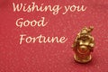 Figurine of a laughing and cheerful golden Buddha Royalty Free Stock Photo