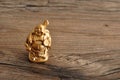 Figurine of laughing golden Buddha Royalty Free Stock Photo