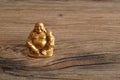 Figurine of laughing golden Buddha Royalty Free Stock Photo