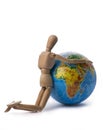 Figurine of a man hugging his hands Globe Royalty Free Stock Photo