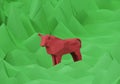 Figurine of a red low poly bull on polygonal green background