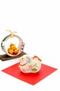 Figurine of Sheep and Three golden straw rice bags. Royalty Free Stock Photo