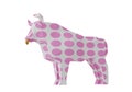 Figurine of a simplified polygonal Bull with pink spots, a symbol of the new year 2021