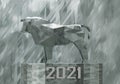 figurine of a simplified polygonal metal bull on a stand, a symbol of the new year 2021