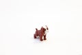 figurine small toy red yellow brown dog on white background isolated object Royalty Free Stock Photo