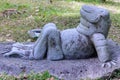 The figurine of a sunbathing frog in the tropical forest in Yanoda Park, Sanya city. Hainan island, China