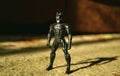 Kopeysk, Russia - August 10, 2021. Batman toy stands on a carpet and is illuminated by sunlight Royalty Free Stock Photo