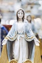 Figurine of the Virgin Mary with open arms