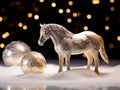 a figurine of a white horse stands on artificial snow and two white balls Royalty Free Stock Photo