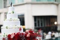 Figurines of the bride and groom on a wedding cake.Funny figurines suite at a luxury wedding white cake decorated . Royalty Free Stock Photo