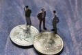 Figurines gathered around the bitcoin, an interpretation of investors