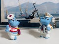 Figurines hippos of a sailor and a captain against the background of the seaport. Hobby. Kinderfilia