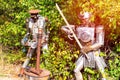 Figurines of iron Medieval knight with sword and a soldier