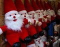 Figurines of Santa Claus on a street stand