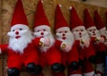 Figurines of Santa Claus on a street stand