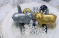 Figurines of two piggys on the holiday table Royalty Free Stock Photo