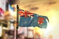 Fiji Flag Against City Blurred Background At Sunrise Backlight