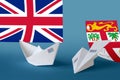 Fiji flag depicted on paper origami airplane and boat. Handmade arts concept Royalty Free Stock Photo