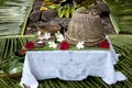 Fiji - table prepared for guests. Table decorated with white cloth and fresh flowers of the garden.