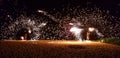 Fijian fire dancers on the beach spinning