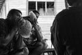 Fijian men blowing conch shells