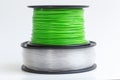 Filament for 3D Printer crystal clear and bright green against a Royalty Free Stock Photo