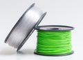 Filament for 3D Printer crystal clear and bright green against a Royalty Free Stock Photo