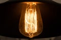 Filament inside warm light bulb Royalty Free Stock Photo