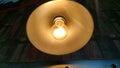 Filament inside warm light bulb Royalty Free Stock Photo