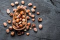 Filberts or hazelnuts in the wooden bowl on the table.