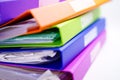 File Folder Binder stack of multi color on table in office. Royalty Free Stock Photo