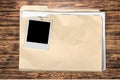 Yellow file folder on wooden background