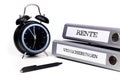 File folders and alarm clock symbolize time pressure. Translation: 