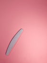 file for polishing nails, manicure sets for the work of the nail master on a pink background Royalty Free Stock Photo