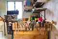 File, screwdriver, hammer, pliers, garden tools on a wooden shelf in a garage Royalty Free Stock Photo