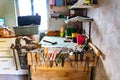 File, screwdriver, hammer, pliers, garden tools on a wooden shelf in a garage Royalty Free Stock Photo