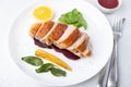 Files of the breast duck grill with beets, mini corn and spinach, fried sage, orange and lingonberry sauce.