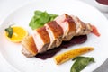 Files of the breast duck grill with beets, mini corn and spinach, fried sage, orange and lingonberry sauce.