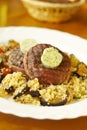 Filet mignon with butter, couscous and vegetables