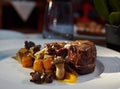 Filet mignon with cubes of baked sweet potato and mushrooms