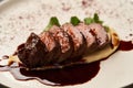 Filet mignon with mashed potatoes and pomegranate sauce, close-up Royalty Free Stock Photo